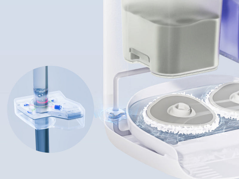 Close-up of the Narwal Freo X Ultra robot vacuum and mop’s self-cleaning system, showcasing the water tank and rotating mops.