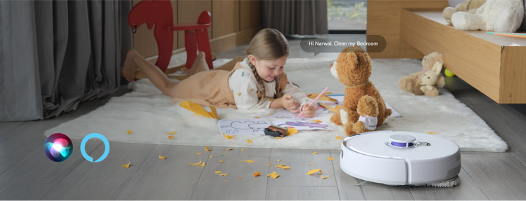 A young girl plays with crayons and a teddy bear while giving a voice command to the Narwal Freo Z Ultra robot vacuum to clean her bedroom.